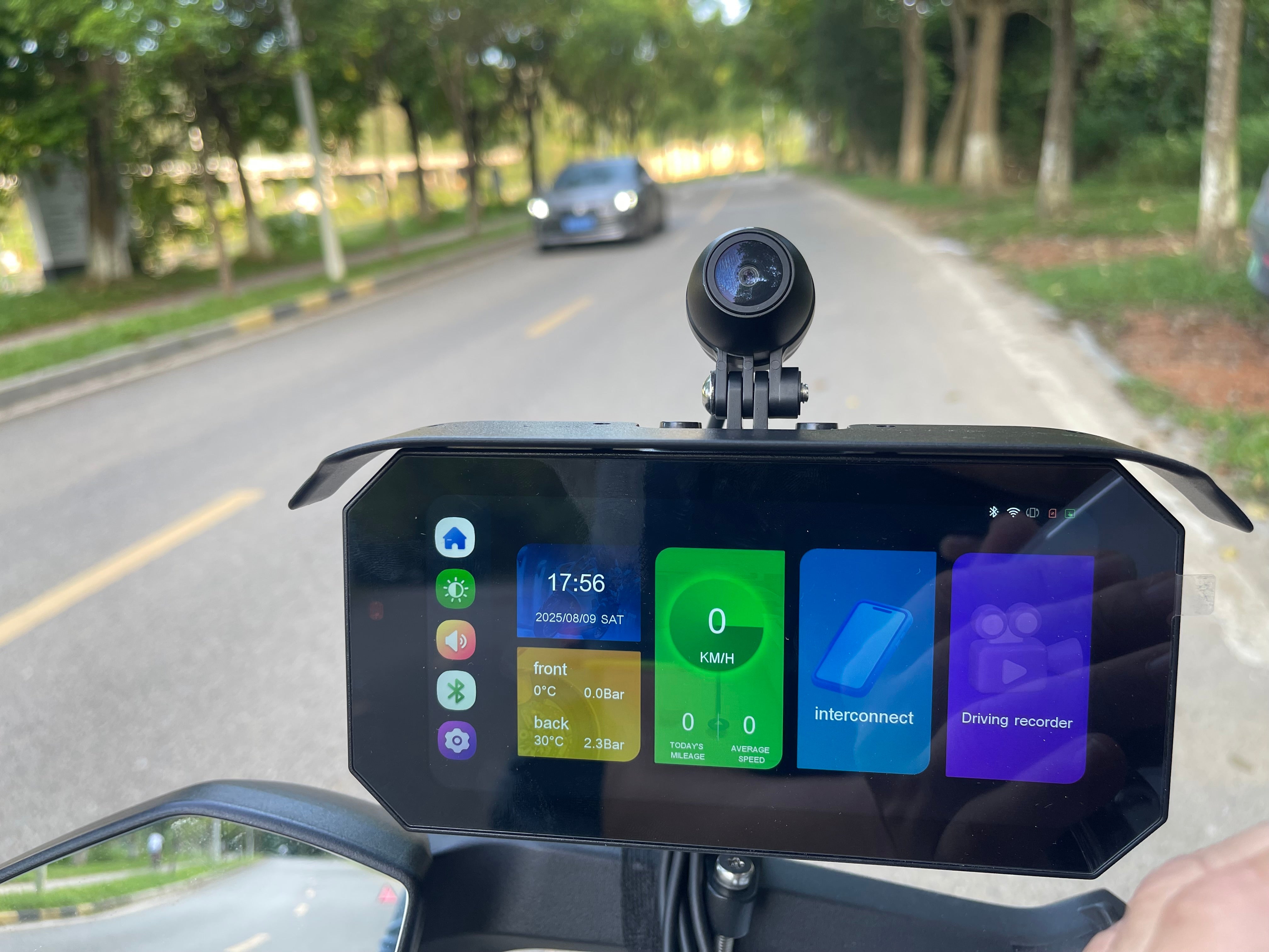 Front and rear motorcycle dash cam setup showing riding perspective and road coverage
